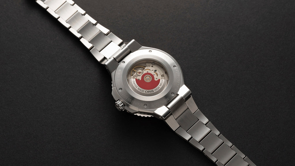 Oris Aquis Date watch, 43.50mm in diameter, featuring a black dial, stainless steel case, and a unidirectional rotating bezel, displaying its functional design and elegant style, reference number 01 733 7789 4154-07 8 23 04PEB. Back mechanism view.