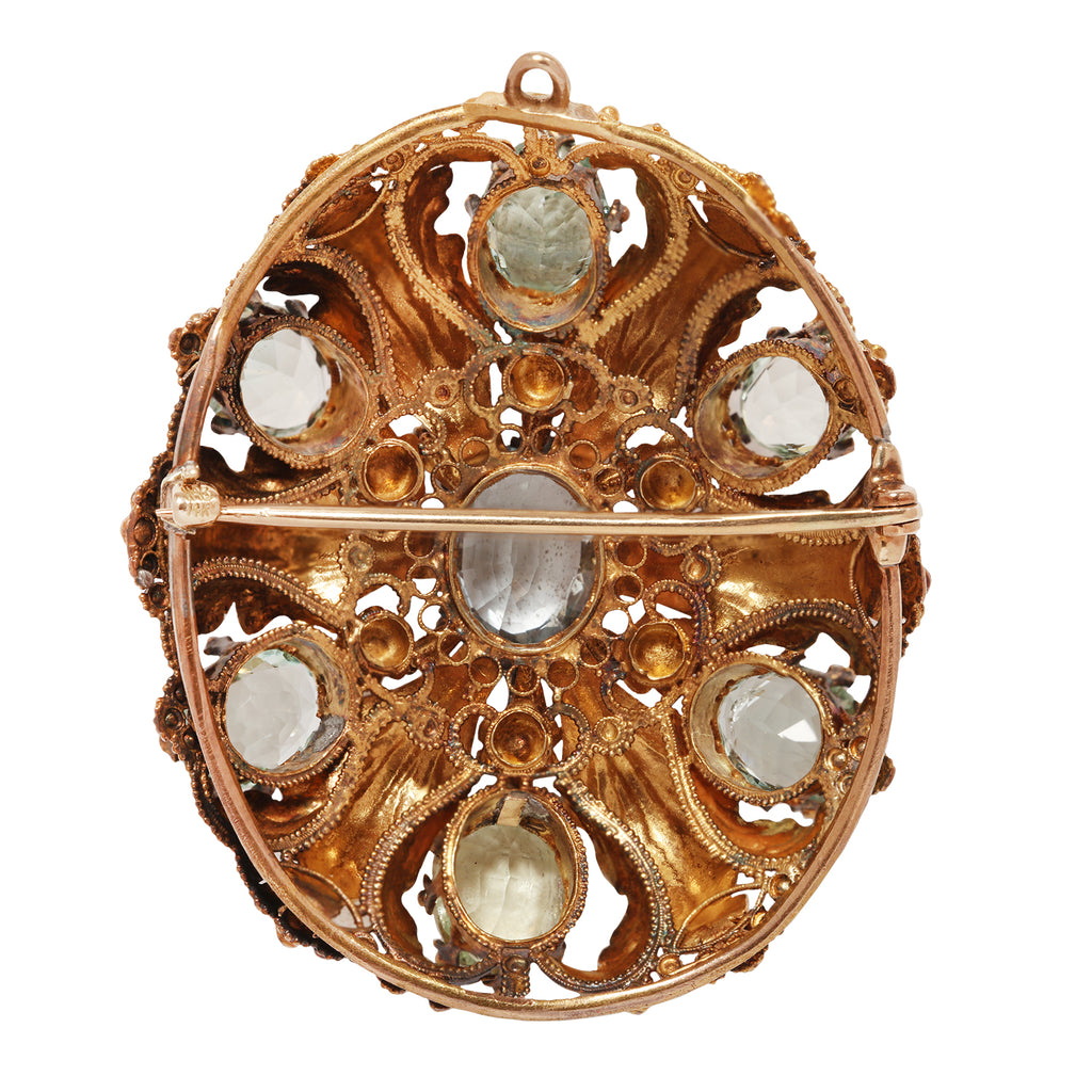 Elegant oval aquamarine pin with seven bead-set stones, engraved oak leaves, floral details, and milgrain accents.