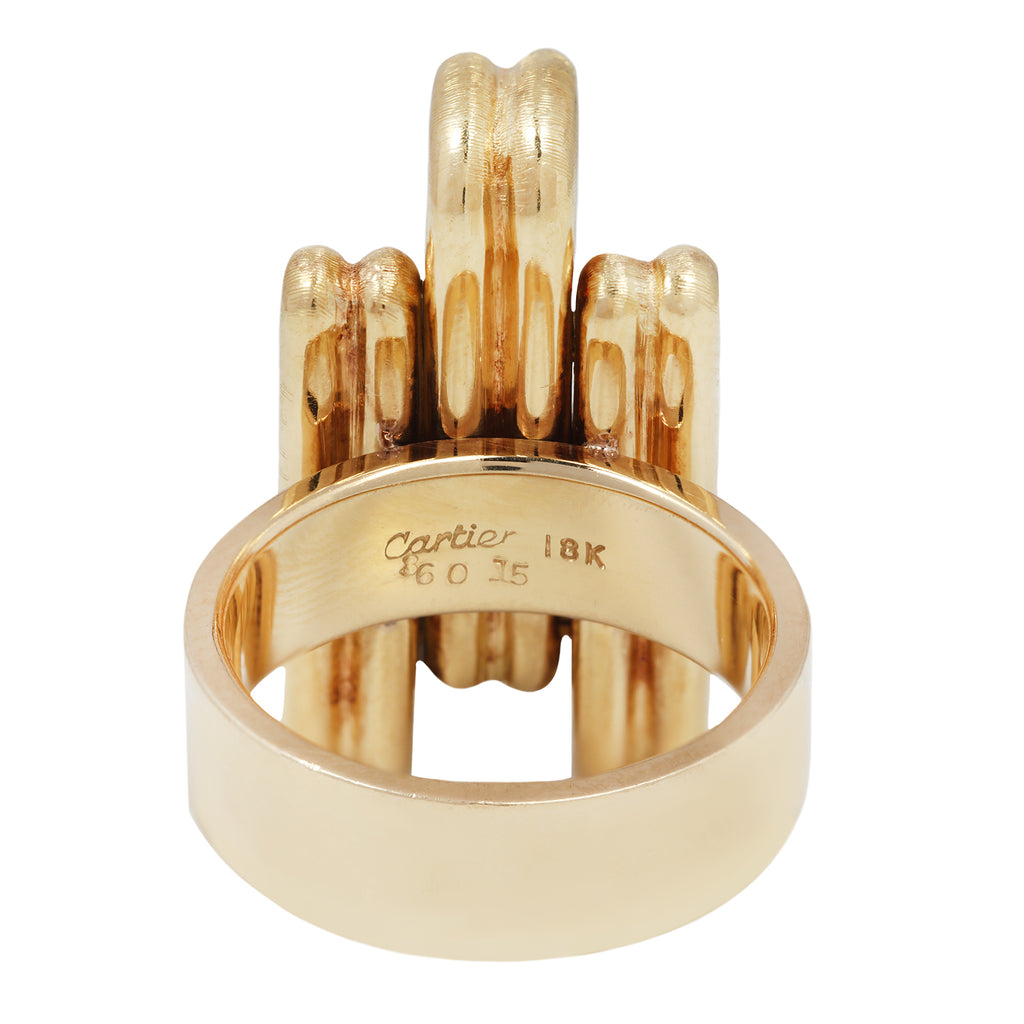 Side profile showing wide gold shank with sculptural links.