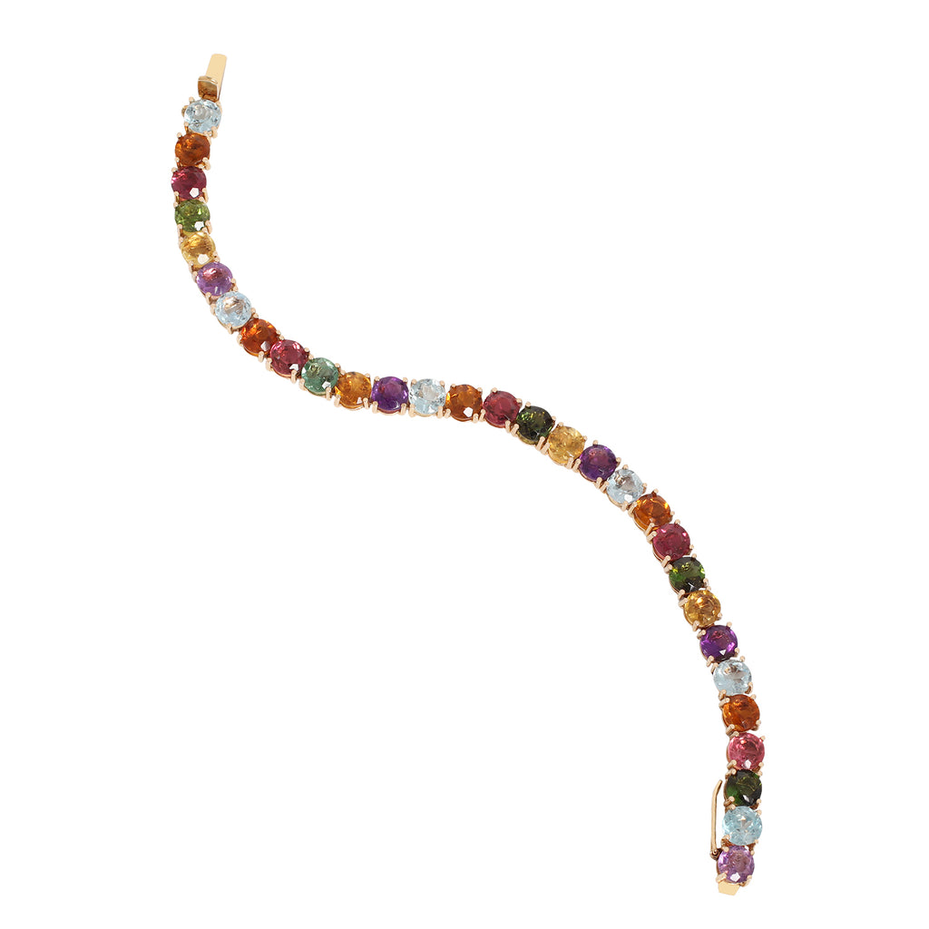 Full view of a multi-colored gemstone 18k yellow gold tennis bracelet.