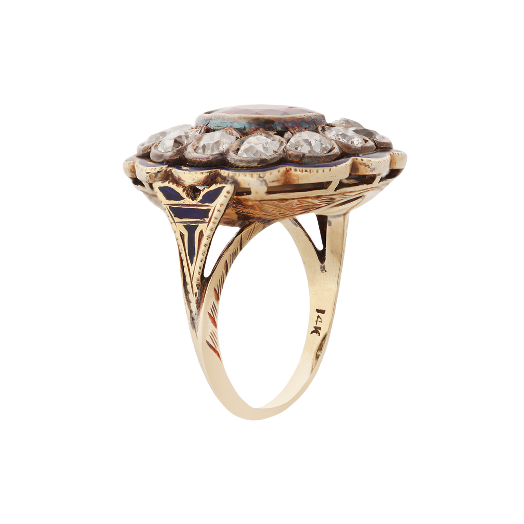 Victorian ring with bezel set ruby, bezel-set diamond clustered around the center stone and blue enamel around the border. Side View show enameling and engraving.