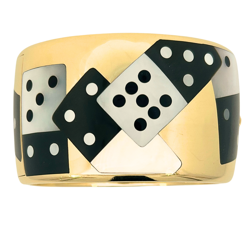 Front view of an Angela Cummings for Tiffany & Co. 18k Domino bangle with mother of pearl and black jade inlay, circa 1990–1995.