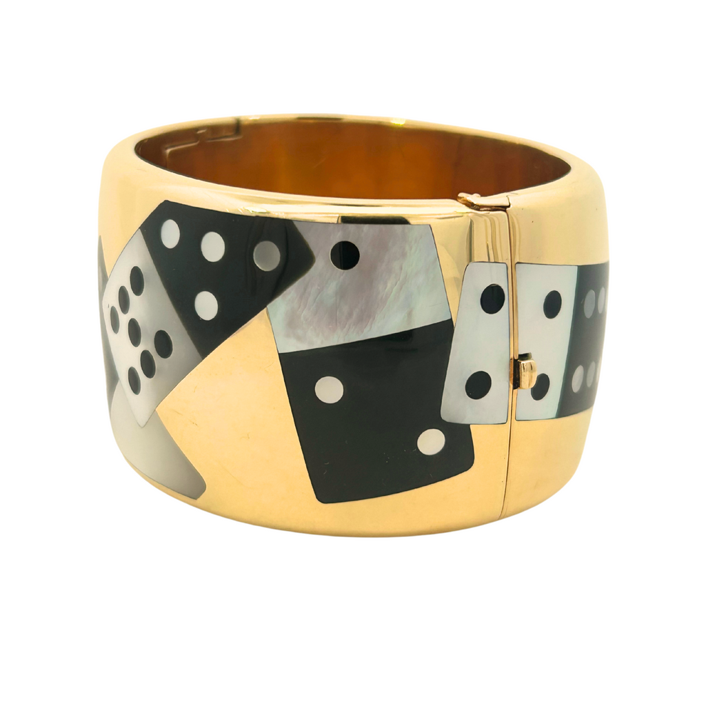 Side view of an Angela Cummings for Tiffany & Co. 18k Domino bangle with mother of pearl and black jade inlay, circa 1990–1995.