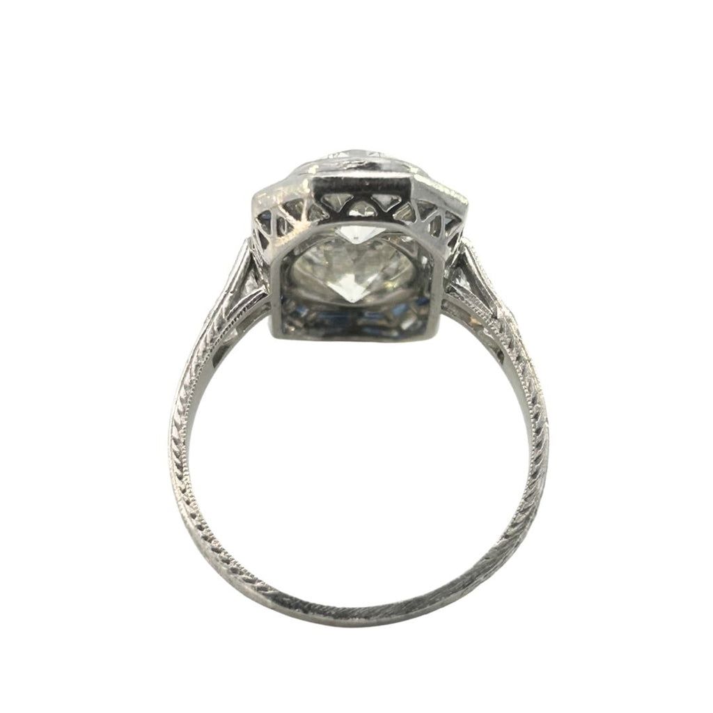 North–south Art Deco diamond and sapphire plaque ring in platinum with openwork gallery and engraved shank