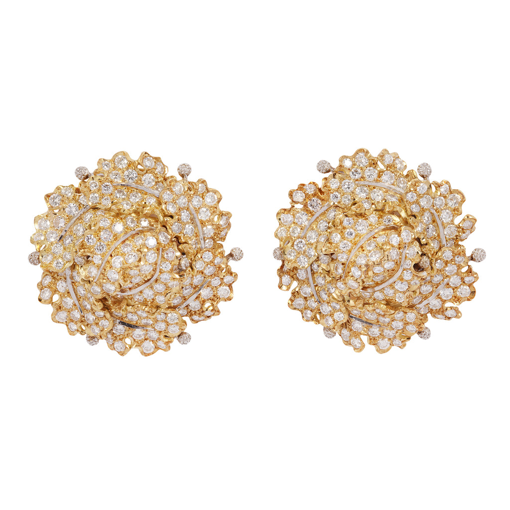 Front view of estate Buccellati clip-on earrings featuring 18k yellow gold oak leaf clusters with round brilliant diamonds and white gold accents.