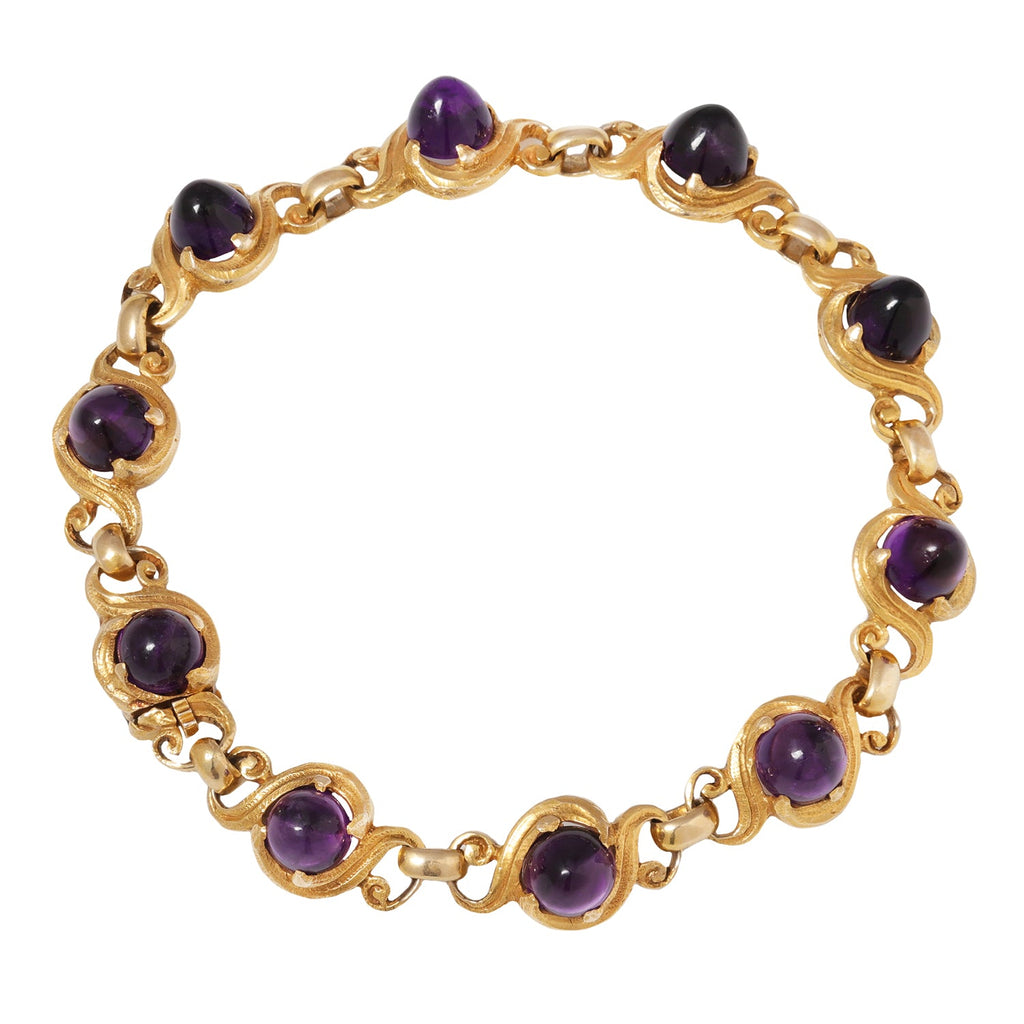Arts and Crafts bracelet with bullet-shaped Amethyst cabochons set into  individual hand-made gold swirls, full view