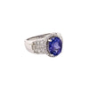 Angled view of 18K white gold 2.95 carat oval tanzanite and diamond halo ring