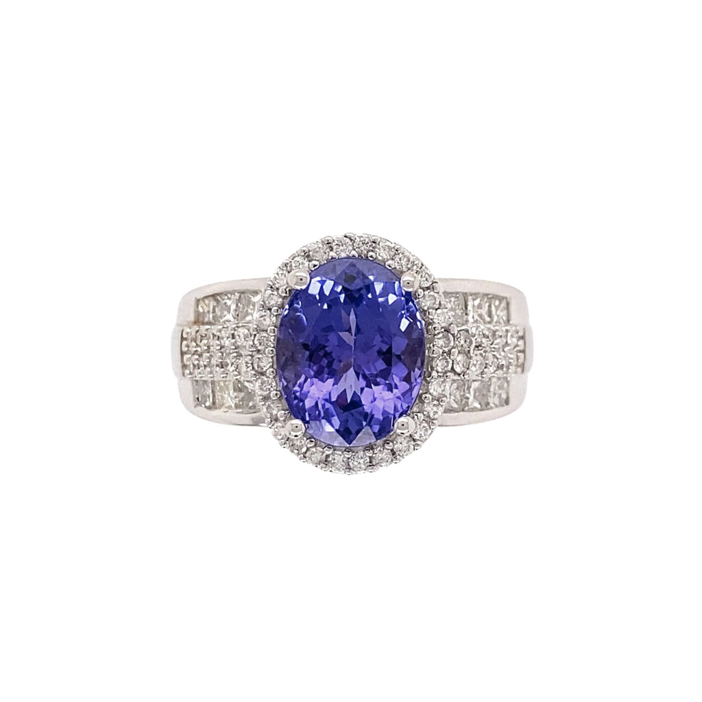 Front view of oval tanzanite ring with diamond halo and three-row diamond shoulders