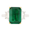 4.81 carat emerald flanked by two trapezoid cut diamond ring in platinum setting