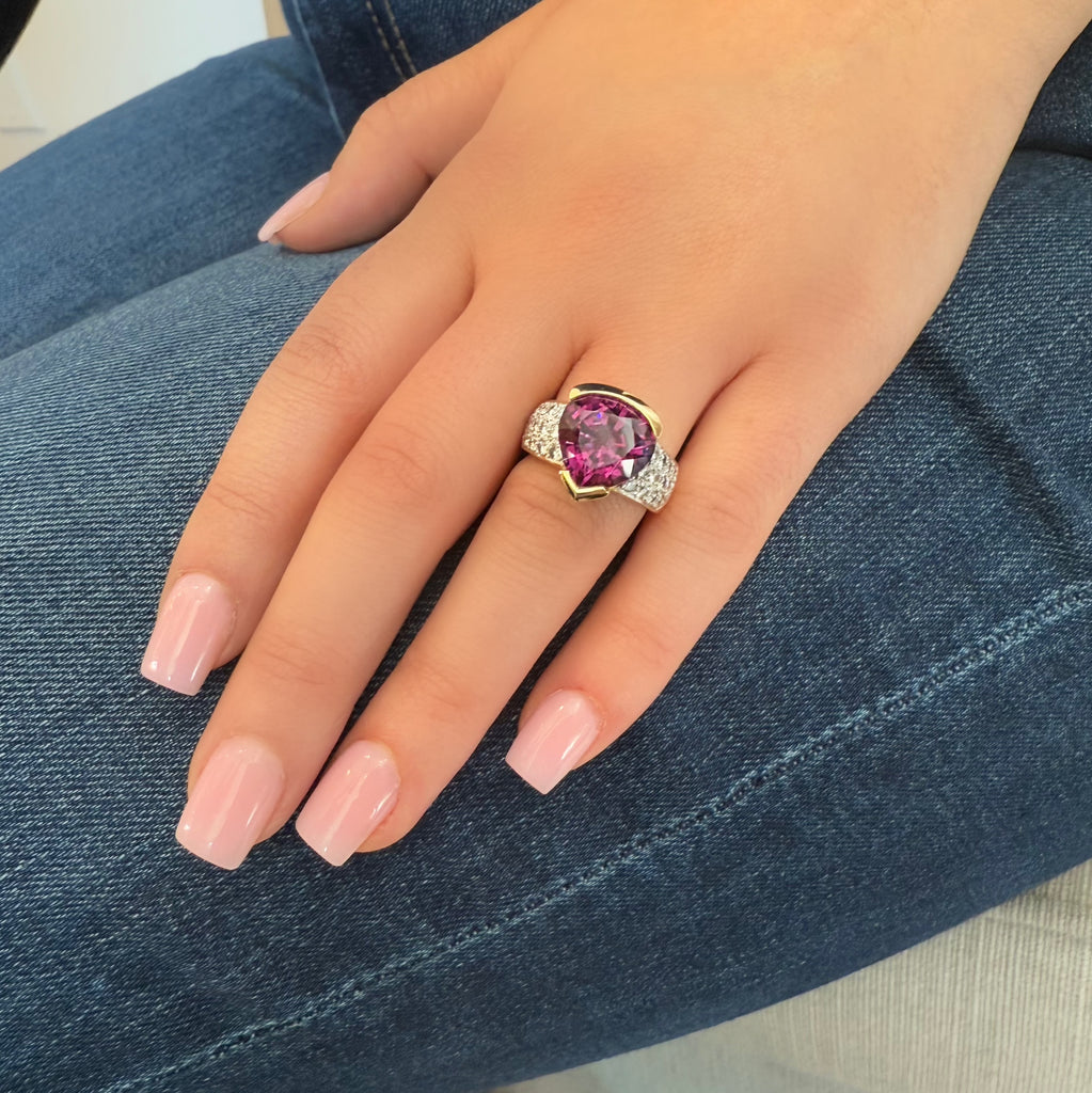 18K gold ring with a pear-shaped Rhodolite garnet, diamond pave band, designed by Barbara Westwood. On model view