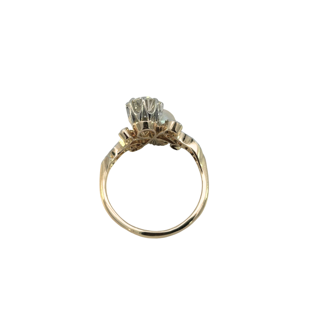 Side profile showing platinum top, pearl, and diamond setting of Edwardian ring.