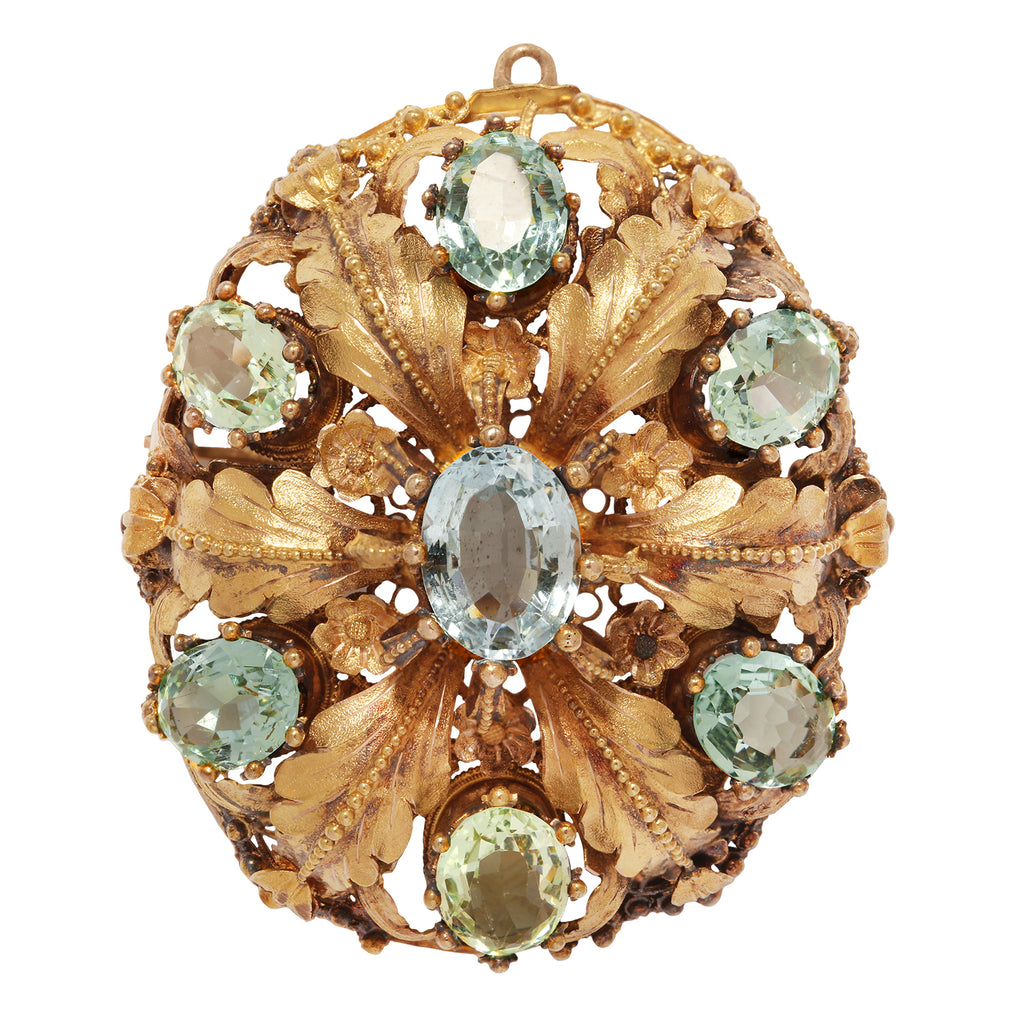 Elegant oval aquamarine pin with seven bead-set stones, engraved oak leaves, floral details, and milgrain accents. Front