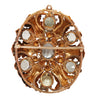 Elegant oval aquamarine pin with seven bead-set stones, engraved oak leaves, floral details, and milgrain accents.