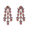 Front view of 18K gold chandelier earrings with pink sapphires, rose-cut diamonds, and pearls.