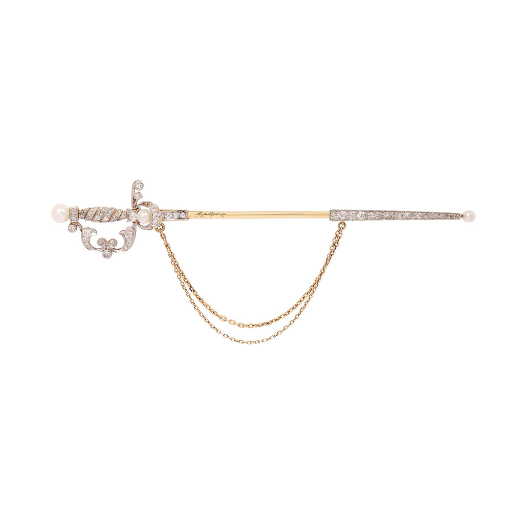 Antique 18k gold and platinum diamond sword pin with pearl accents and draped chains shown in detailed front view.