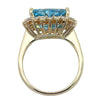 Side view of aquamarine and diamond ring showing raised basket setting