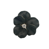 Front view of black enamel pansy brooch featuring cushion Old Mine Cut diamond center.