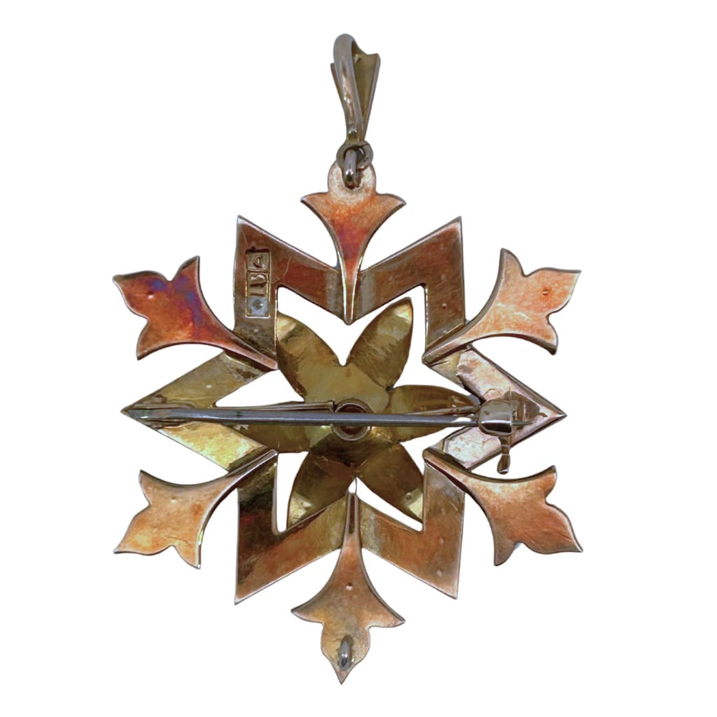 Back view of starburst brooch showing pin stem and bail