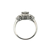 Back view of vintage platinum engagement ring showing illusion head and curved details