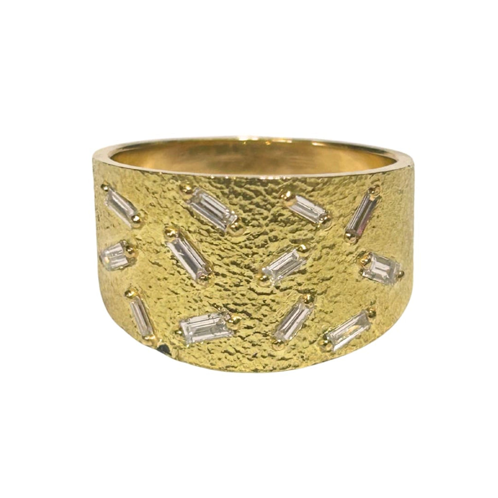Textured yellow gold band ring with scattered baguette diamonds