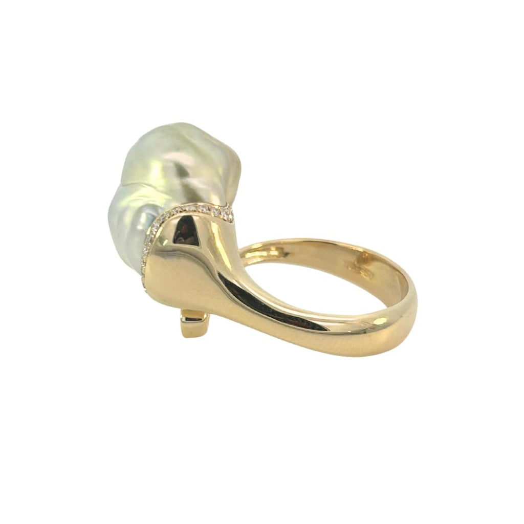 Contemporary bypass design ring with large baroque South Sea pearl and diamond accents