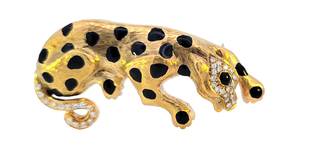 18k yellow gold panther brooch with black enamel spots and diamonds on head and tail. Can be turned into a necklace.