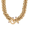 Wide braided yellow gold collar necklace with hinged loop clasp that is finished by amethyst cabochon studded finials. Detail of clasp.
