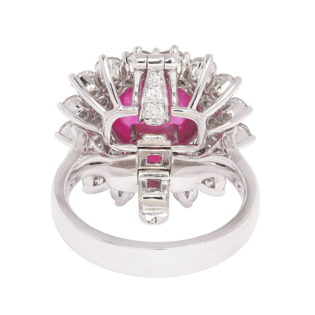 Back view of a platinum ring featuring a no-heat Burmese cabochon pink sapphire with diamond basket setting.