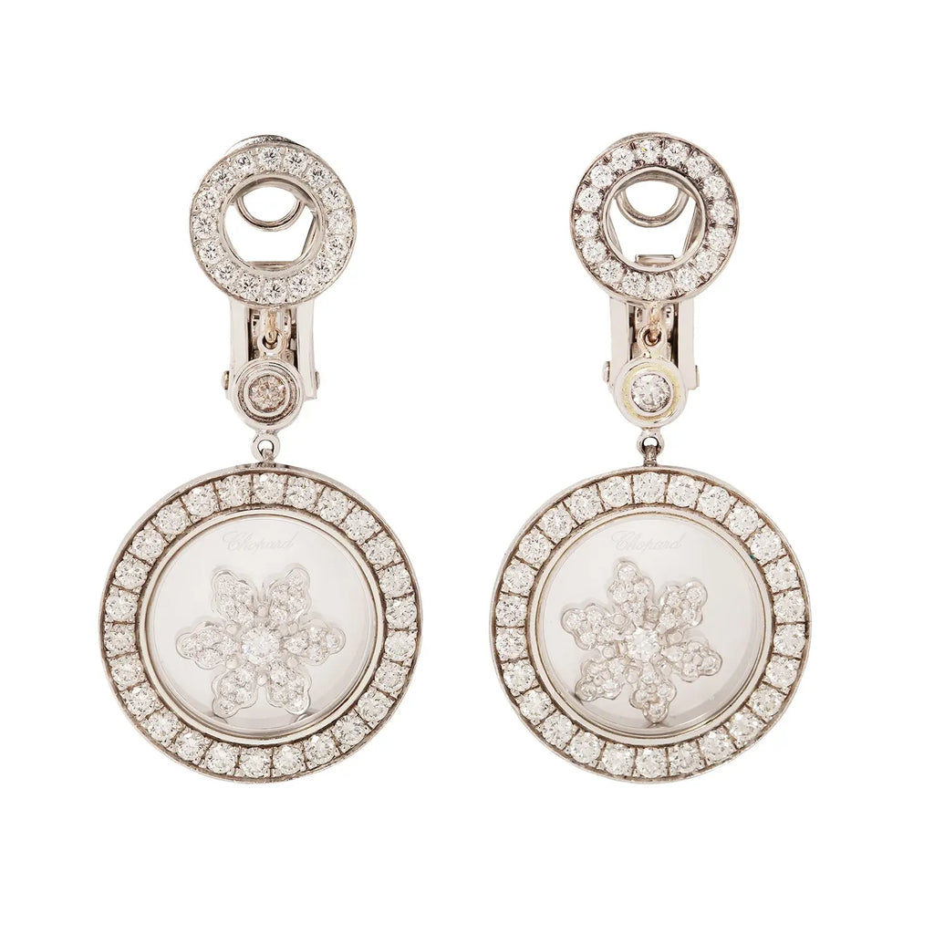 Chopard Happy Diamonds snowflake earrings with floating diamond detail close-up