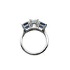 Side profile of cushion diamond and sapphire three-gemstone ring with pavé-set gallery and polished band