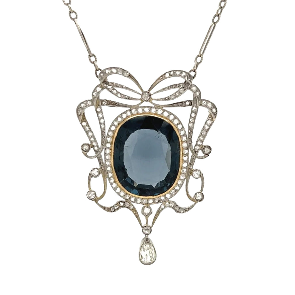 Front view of Edwardian 12.0 carat natural no-heat blue spinel and diamond bow pendant necklace