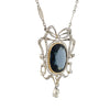Angled side view of Edwardian blue spinel pendant with diamond halo, openwork setting, and dangling old European cut diamond