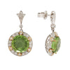 Stunning two-tone 18K gold drop earrings with large round peridots, diamond halo, and secure post-back closure. Side view.