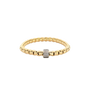 Stretchable gold bracelet by FOPE in yellow gold and a white gold rondel set with pave set diamonds.