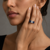 Front view of 2.02 carat cushion diamond ring flanked by two cushion-cut blue sapphires
