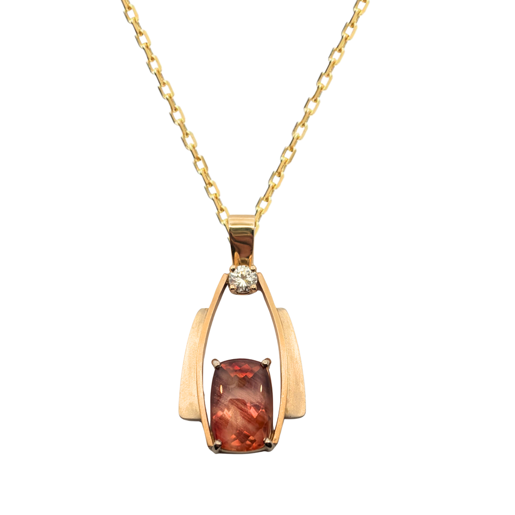 Gordon Aatlo 14K two-tone gold pendant featuring a cushion buff-top Oregon sunstone and diamond accent