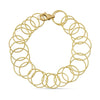 Buccellati Hawaii Yellow Gold Bracelet showcasing hand-twisted, interwoven gold circles in a luxurious design, a handcrafted Italian jewelry masterpiece.