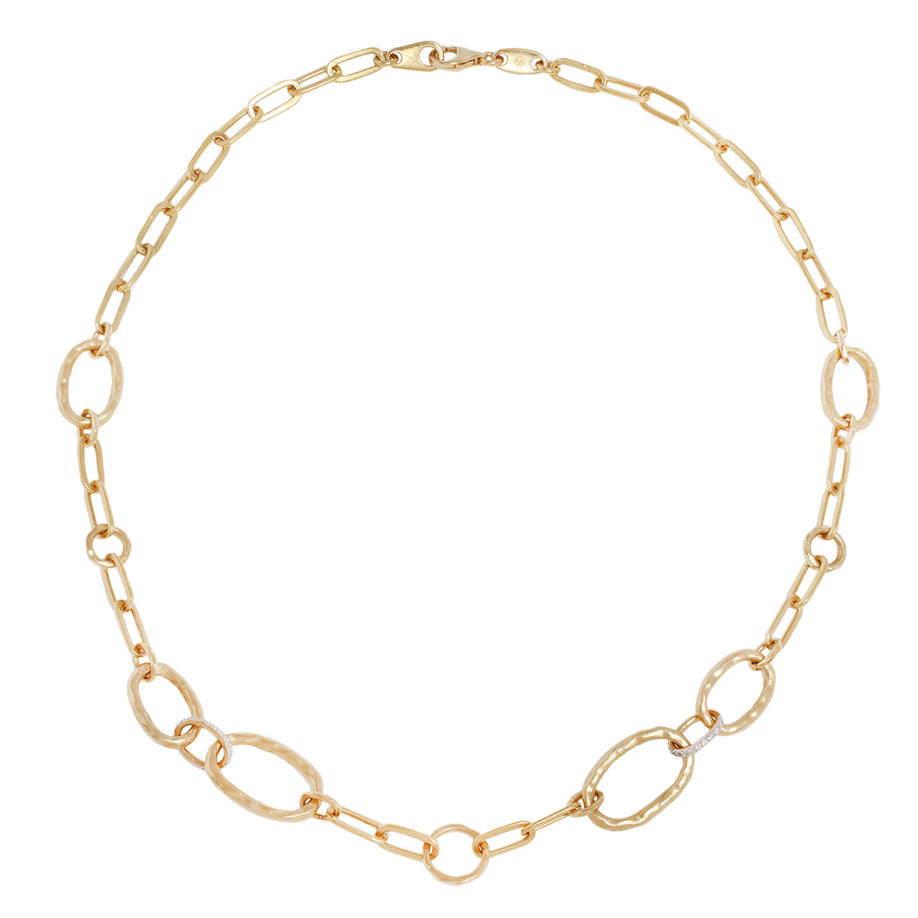 Full view of hammered Oval links connected with two pave set diamond links in yellow gold.