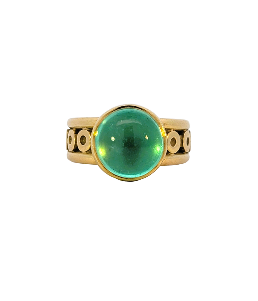 Vintage 18K gold ring with light green cabochon emerald in bezel setting, size 8, with circle accents.