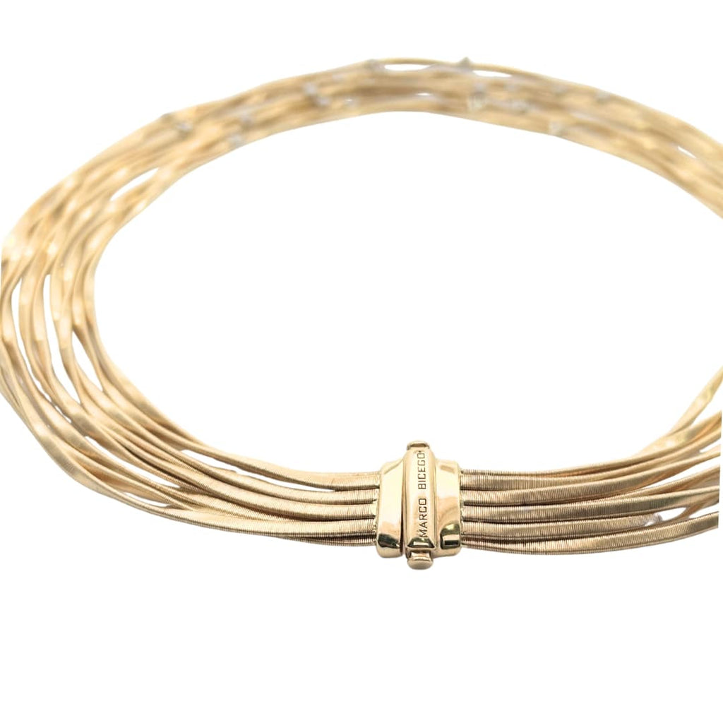 Detail view of Marrakech necklace clasp showing engraved gold strands by Marco Bicego.