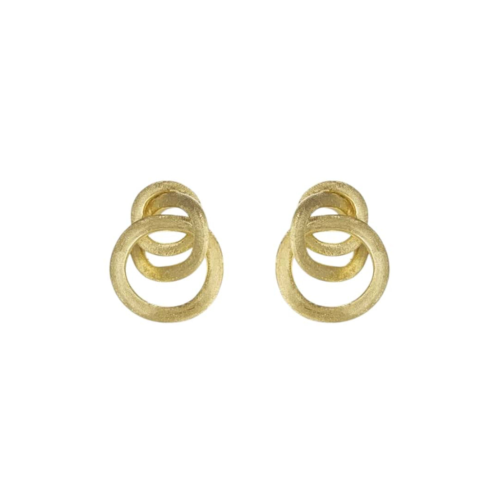 Artistic close-up of Marco Bicego Triple Loop Earrings in hand-engraved 18k yellow gold