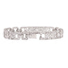 Back view of a MAUBOUSSIN platinum diamond bracelet showing openwork links and hidden tube safety clasp.