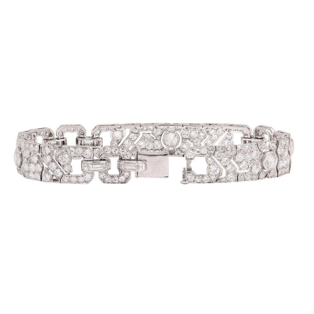 Back view of a MAUBOUSSIN platinum diamond bracelet showing openwork links and hidden tube safety clasp.