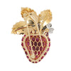 Oscar Heyman strawberry brooch with oval cabochon rubies on the gold body, diamonds on the platinum flowers, and green enamel on the leaves. Back view.