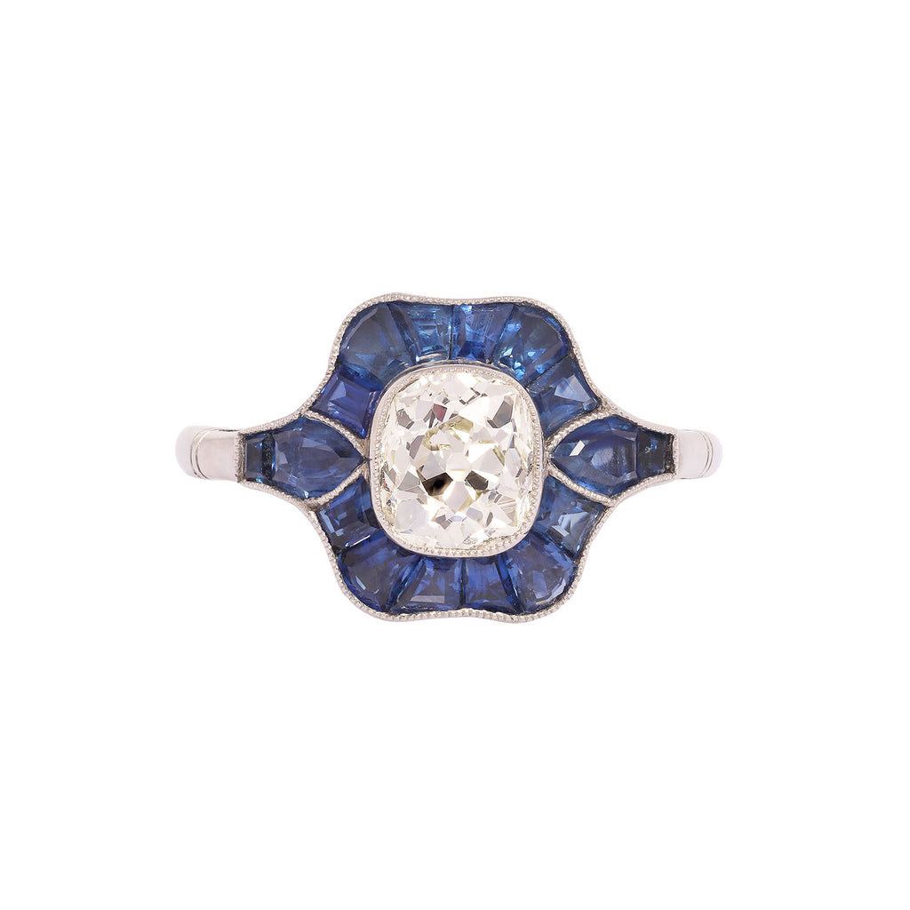 Front view of platinum ring featuring 1.14 ct Old Mine Cut diamond and sapphire halo.