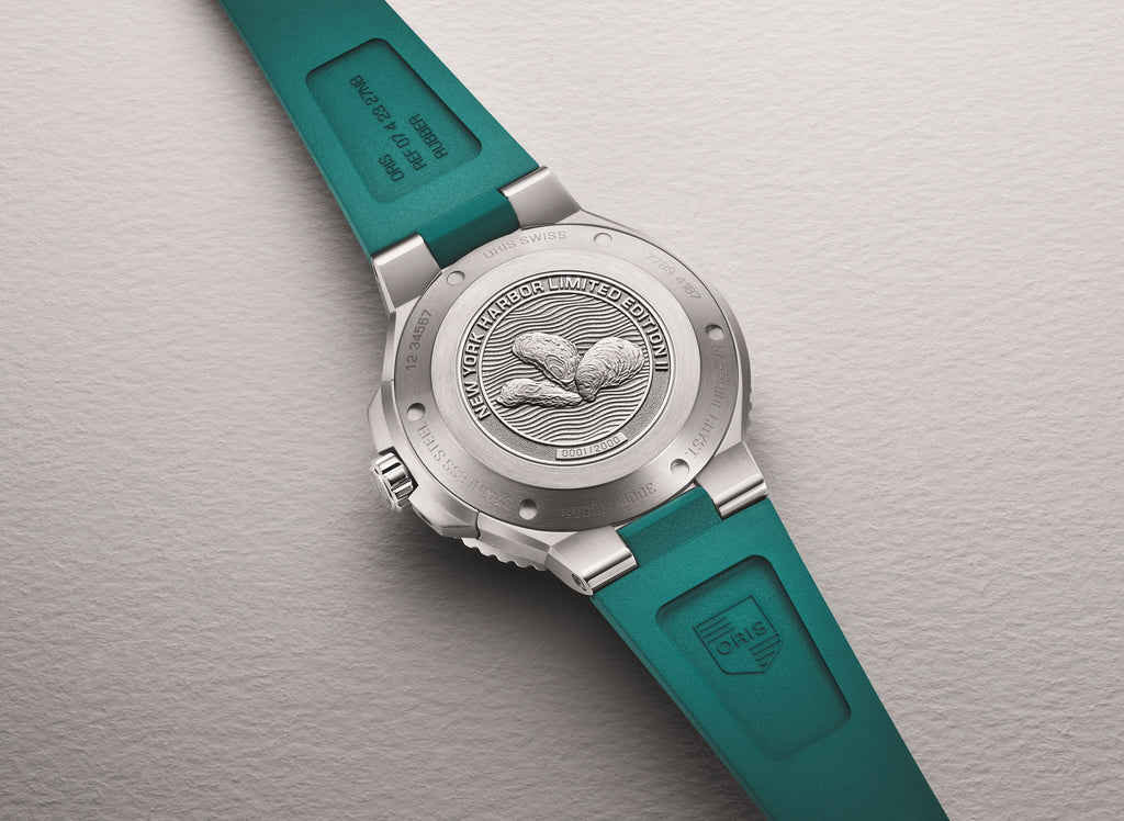 Stainless steel caseback of the Oris New York Harbor Limited Edition II, engraved with oyster motif and limited-edition numbering.