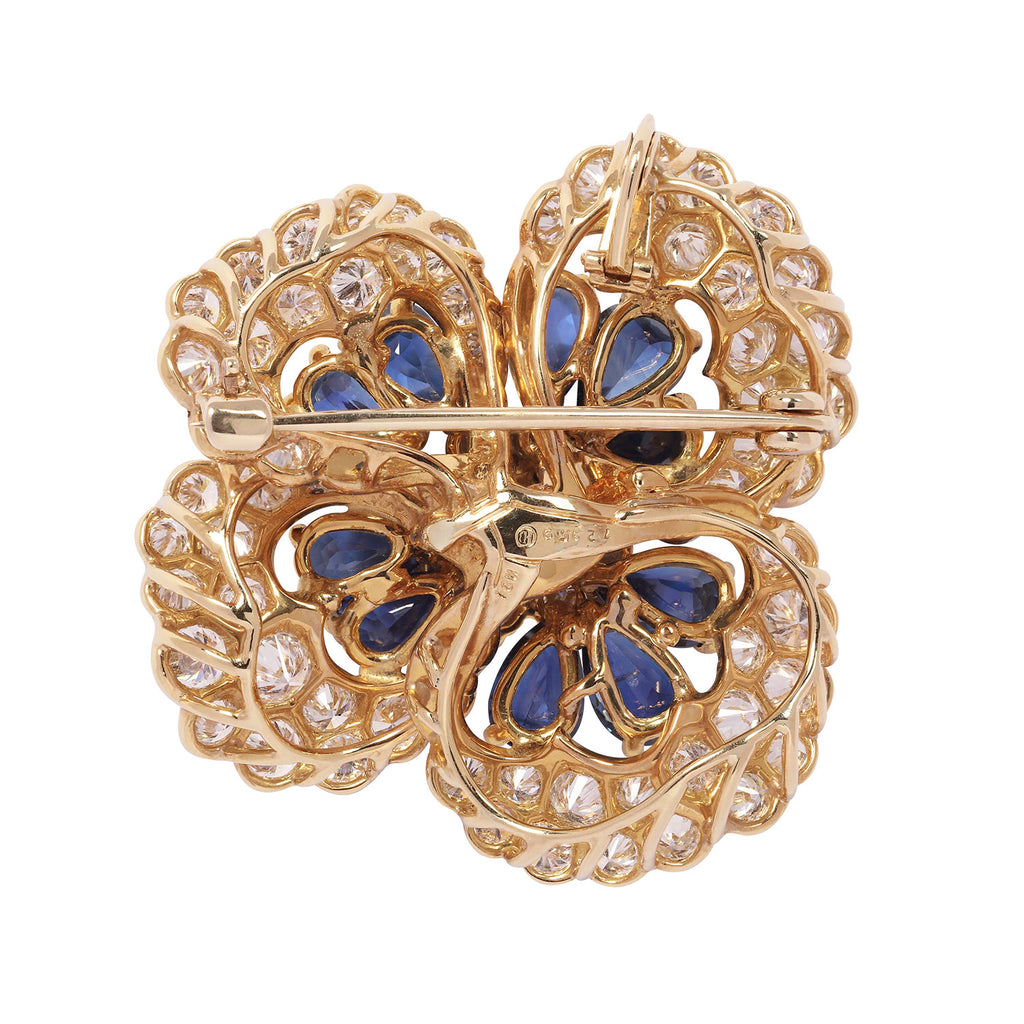 Reverse view of Oscar Heyman floral brooch showing openwork gold and convertible brooch–pendant mechanism.