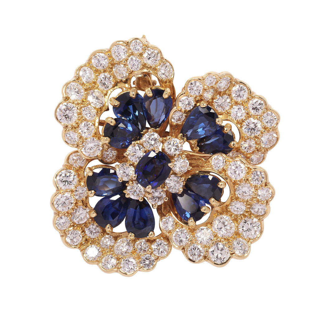 Front view of Oscar Heyman sapphire and diamond flower brooch in 18k yellow gold.