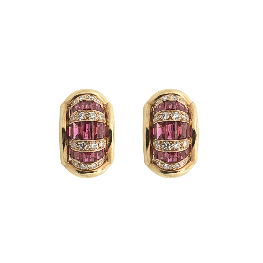 Front view of Oscar Heyman vintage yellow gold earclips featuring channel-set baguette rubies and round brilliant diamond accents in a sculptural half hoop design.