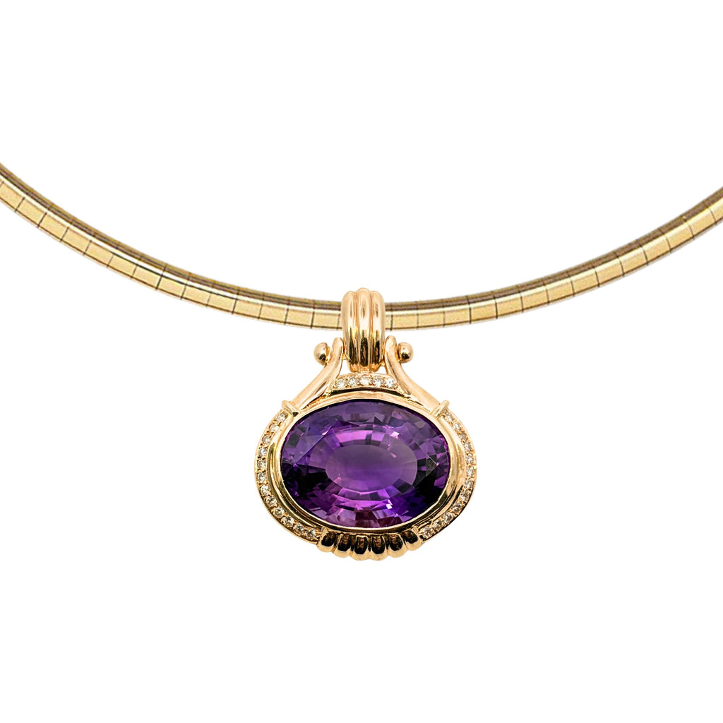 Oval 23.48 carat amethyst and diamond yellow gold pendant with ribbed hinged bail, shown from the front